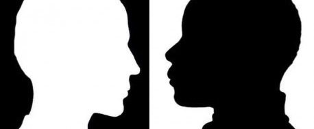 Two silhouettes of a person 's face in the same position.