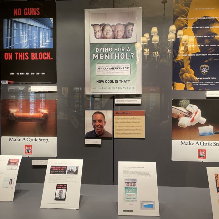 A display case with several different advertisements on it.